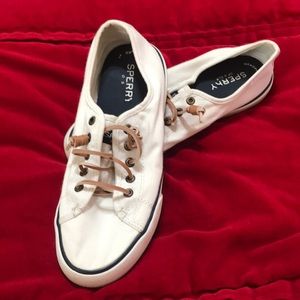 Sperry white canvas sneakers with leather laces.